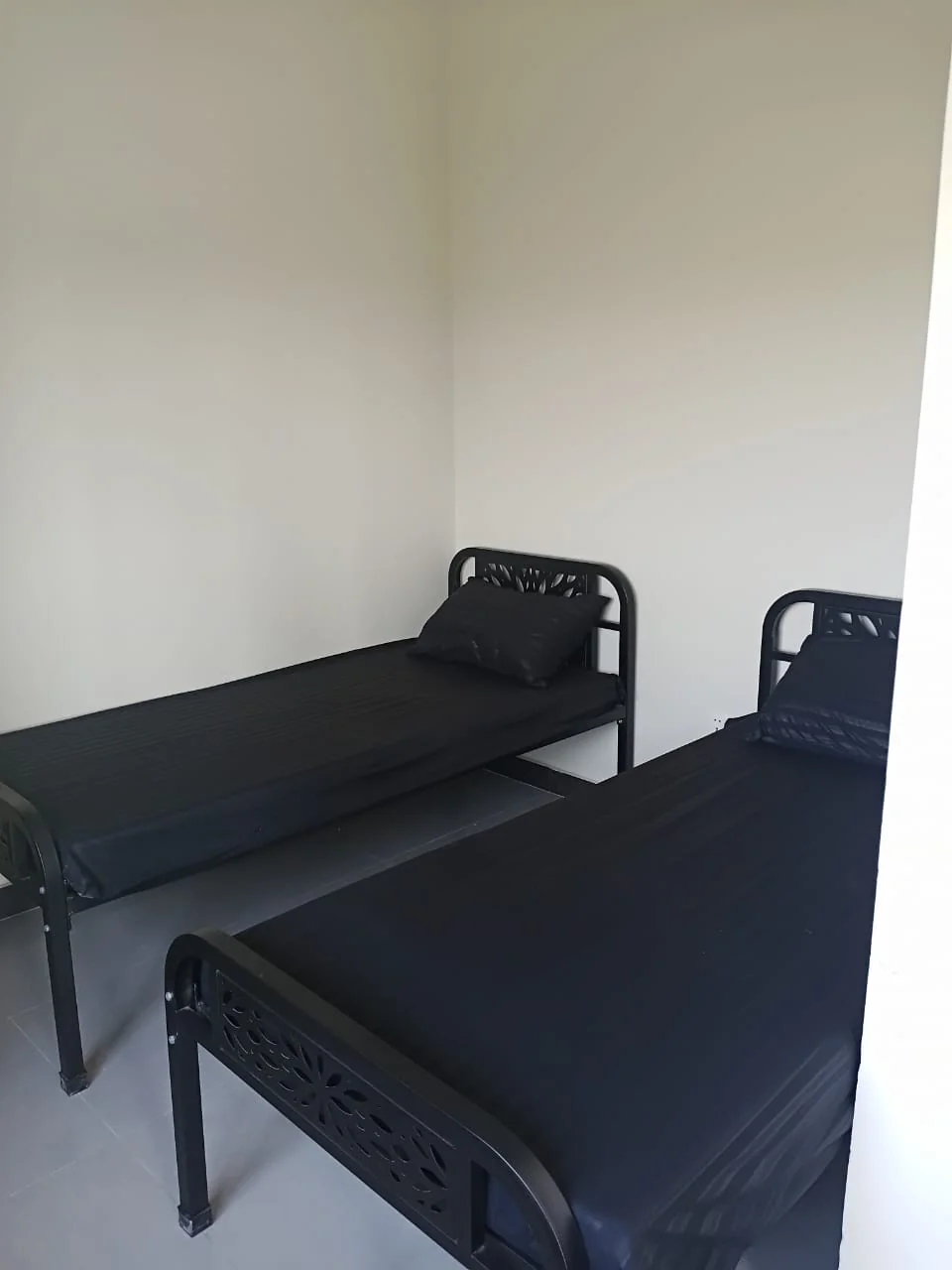 Twin-sharing room at Monarch One